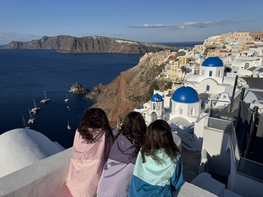 Whitewashed houses and blue domes in Oia, Santorini.